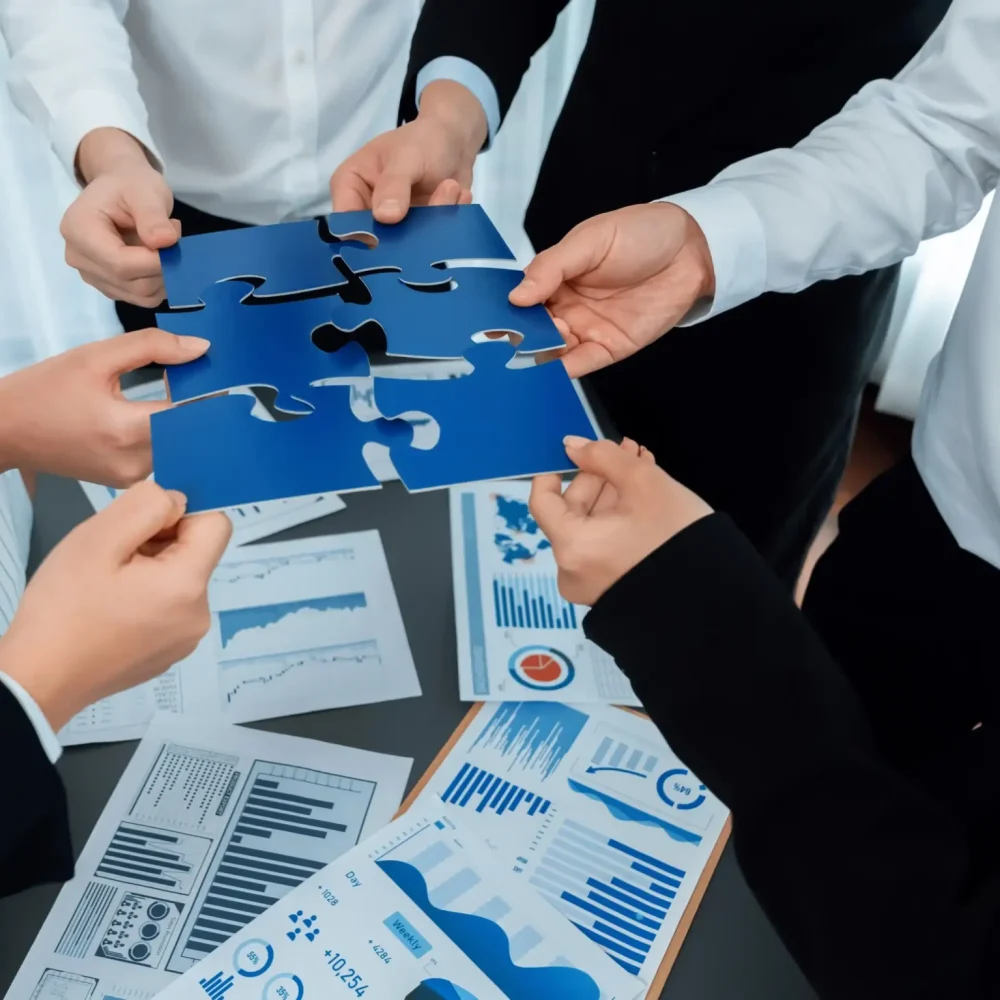 closeup-top-view-business-people-join-jigsaw-puzzle-together-harmony-office